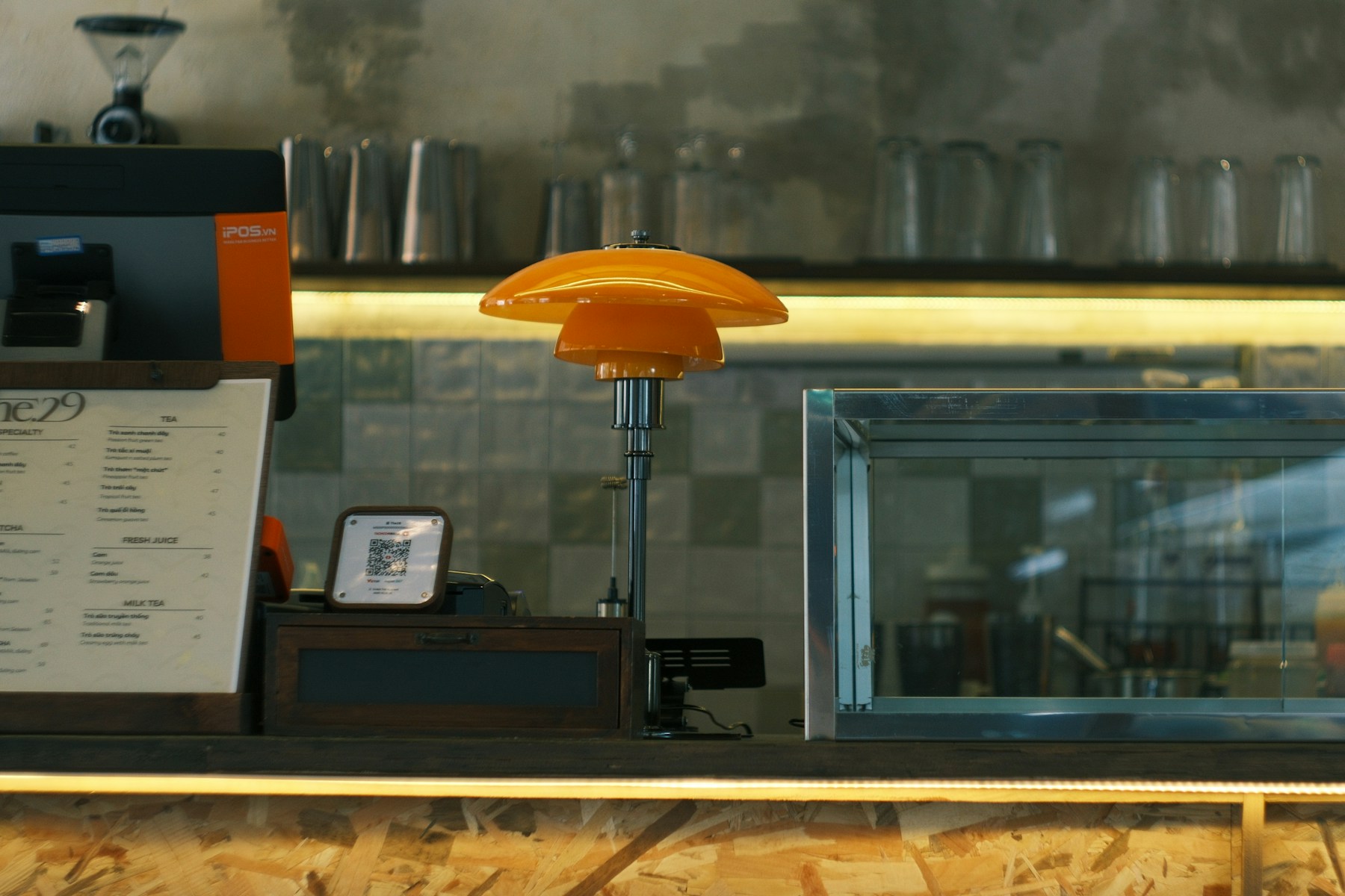 Cafe counter with QR code and point-of-sale setup